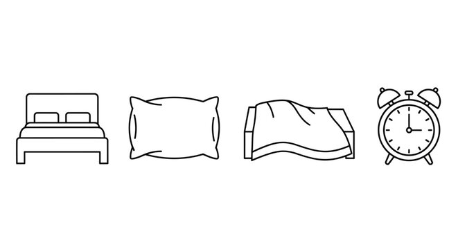 Bed with pillow and blanket and alarm clock.