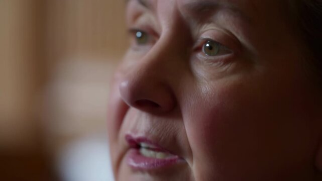 Senior Woman Pondering In Cozy Room. Thoughtful Elderly Lady Reminiscing In Serene Home Setting