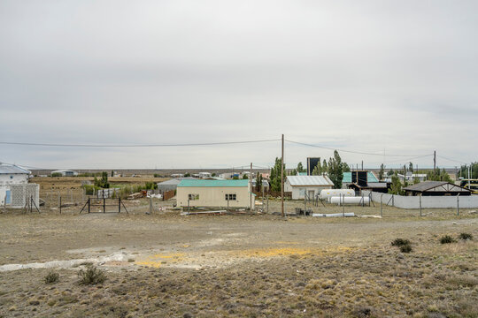 sparse simple buildings in steppe at La Esperanza, Santa Cruz, Argentina