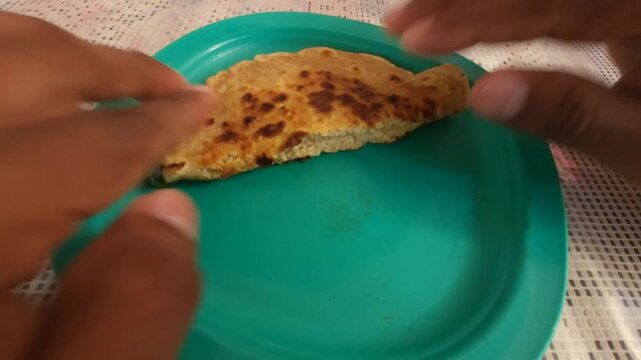 Folding a Wheat Bread Topped with Honey for a Snack