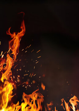 Barbeque poster fire with copy space. Fire embers particles over black background. Fire sparks background. Abstract dark glitter fire particles lights. Poster.