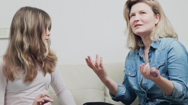 Mother and teenage daughter talking about puberty and feminine hygiene