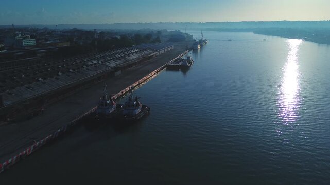 Cinematic Aerial Drone Travel In over the Calm Panuco River During a Beautiful Blue Hour Sunrise with Sun Reflection on the Water between Tampico Tamaulipas and Veracruz Mexico