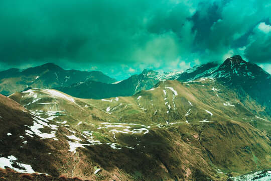 Storm looming over the mountains. Camisolo alp and the Grassi mountain hut. On the right in the photo, the Pizzo Tre Signori mountain peak, Orobie Alps, Lombardy, Italy