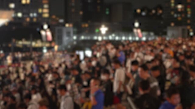 Crowd of people leaving a music festival after the concert