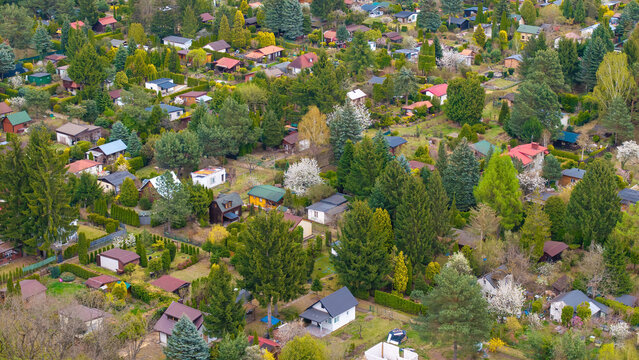 Aerial, drone view of allotment gardens during spring.