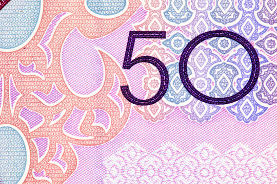 Macro Shot of the Number 50 on a Turkmenistani Manat Banknote. Turkmenistan currency. Money of Asia.