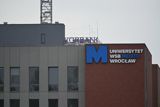 WSB University and Korbank Logos on Office Building Facade in Urban Setting
