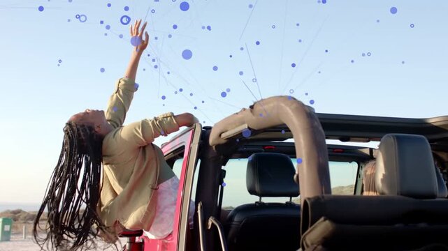 Woman climbing out passenger open-top Jeep stretching up as blue nodes and netlines circling tech