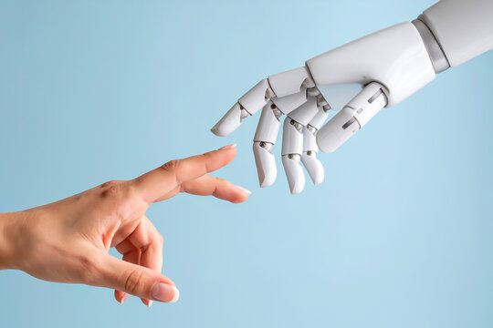 Menschliche Hand ber&uuml;hrt Roboterhand als Symbol f&uuml;r KI und digitale Zukunft