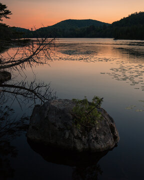 Sunset lake view in Sainte Adele Quebec with shoreline and mountains
