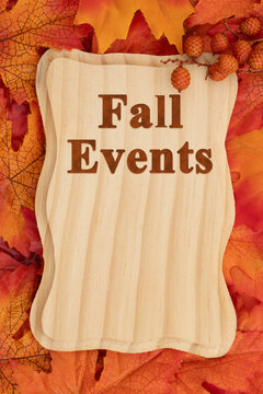 Fall events wood sign with autumn leaves