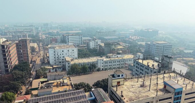 Aerial view of a densely populated urban area with industrial buildings and residential structures