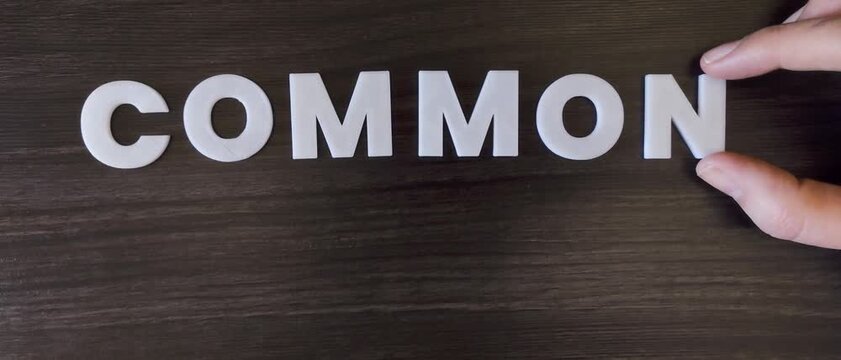 the concept common cold written on a dark background with white block letters or capital letters (fast version)
