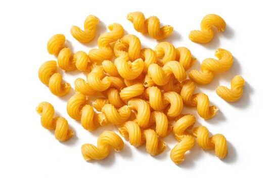 Top view of dry cavatappi pasta spirals on a clean white background with clipping path