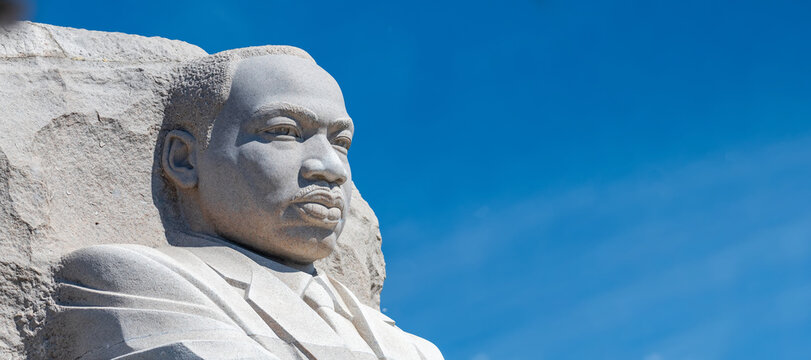 Martin Luther King Jr monument portrait with blue sky background Washington DC USA