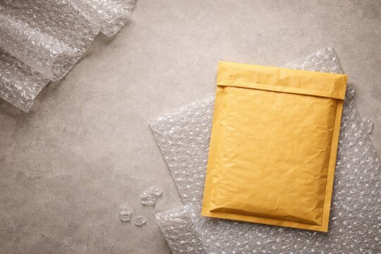 Top view of a padded envelope and bubble wrap with clear copy space