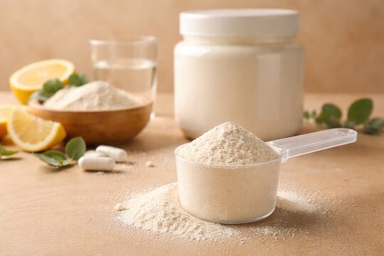 Beige background with hydrolyzed collagen powder scoop emphasizing healthy food supplements