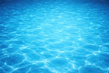 Fototapeta premium Smooth blue pool water background illuminated by studio light with copy space