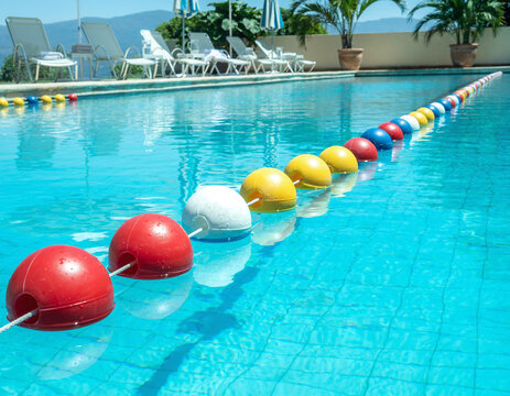 Swimming pool with colorful floaties.