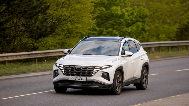 Milton Keynes,Bucks,UK - Apr 19th 2025: 2022 white Hyundai Tucson hybrid electric car driving on a British road