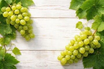 Fototapeta premium Green grape clusters with leaves displayed on white wooden grain copy space