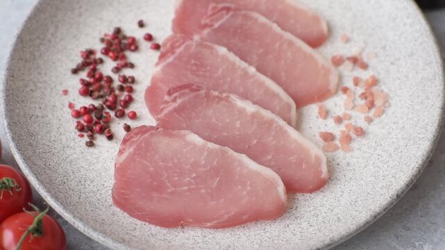 Smoked or dry cured meat slices, pork or ham with salt and spices. Smoked meat slices as a food background for your design