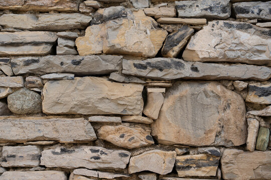 Light limestone fieldstone wall texture rustic natural masonry background closeup