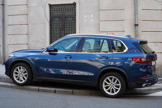 Bucharest, Romania &ndash; April 19, 2026: Side view of BMW X5 SUV blue car parked in the city