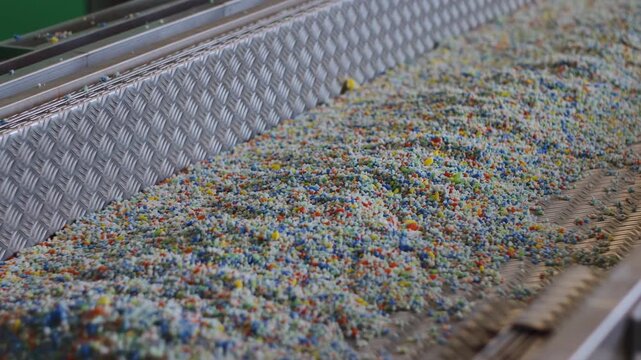 Automated Inspection Of Plastic Granules. Industrial View Of Plastic Recycling With Sensor Technology