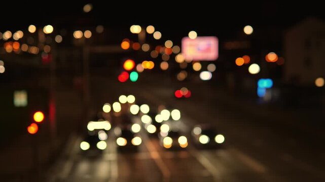 Night City Bokeh Traffic Lights Glowing Across Wet Asphalt Slowmoving Cars With Blurred Headlights Create Cinematic Urban Mood, Neon Signs And Distant Billboards Shimmer