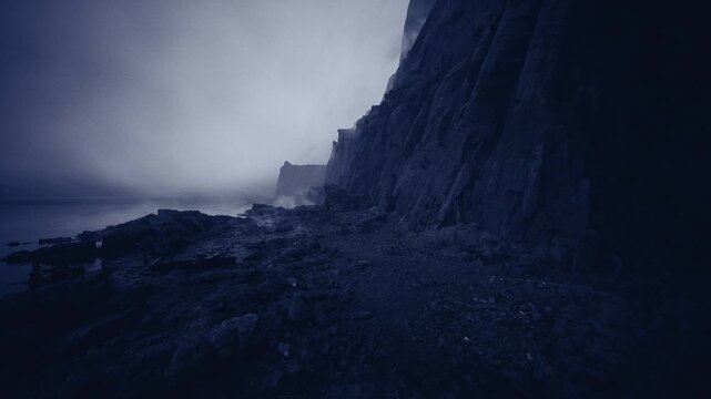 lonely seaside cliffs at dusk cool mist and low waves with rocky foreground and distant pale horizon evoking melancholy and quiet contemplation