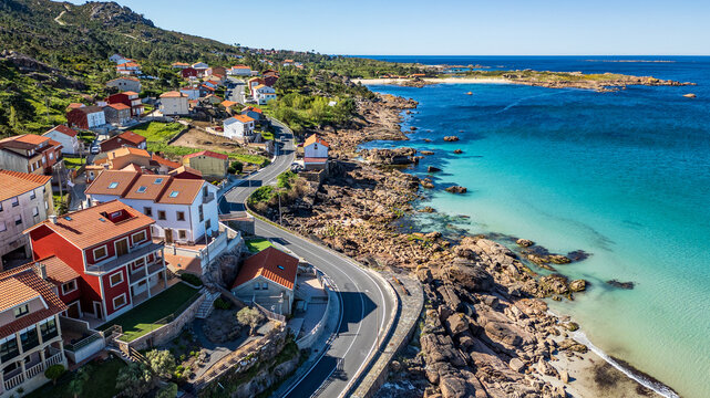 Aerial view of the coastal village of O Pindo and its scenic road, Galicia, Spain.