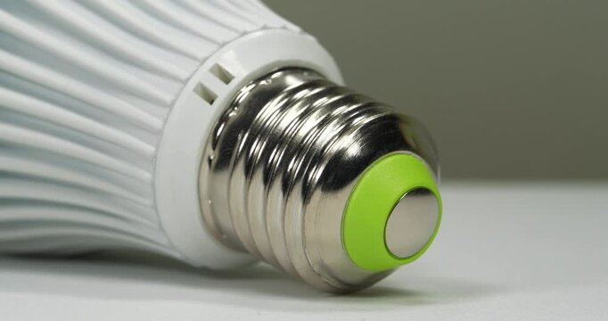 Large white LED lamp with E27 base, close-up shot