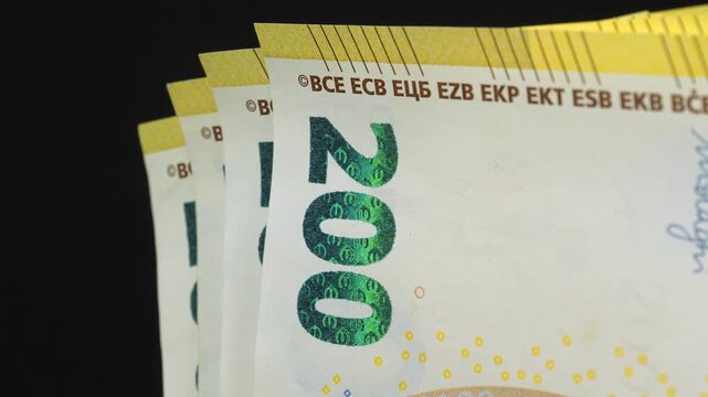 Euro banknotes, EUR. One thousand Euros in five 200 euro banknotes. New yellow two hundred Euro banknotes. European Money. Cash, finance, savings, wealth