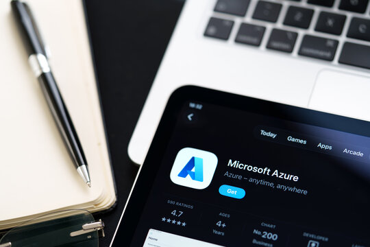 Microsoft Azure listing on iPad highlights Apple Liquid Glass updated design and iOS 26 look in office desk scene. Stafford, United Kingdom, April 13, 2026.
