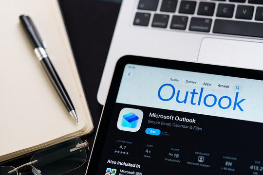 Microsoft Outlook iPad App Store screen showing Apple Liquid Glass redesign and iOS 26 style in workspace closeup. Stafford, United Kingdom, April 13, 2026.