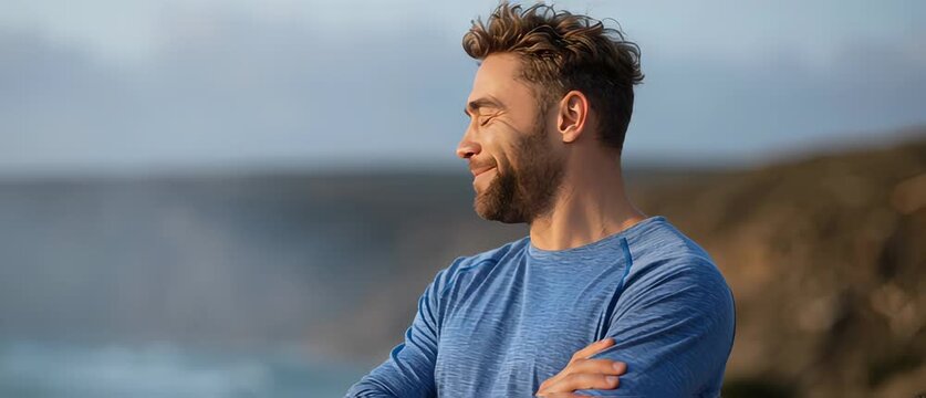 Smiling man enjoying nature in outdoor coastal setting