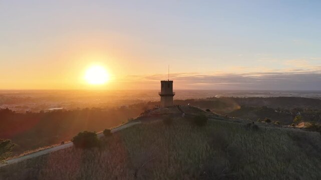Centenary Tower, Mount Gambier, South Australia at sunrise: 4K aerial drone footage of hilltop landmark, golden sunrise, city views and scenic landscape