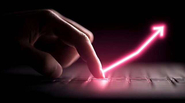 A finger presses a key on a laptop keyboard with a neon pink glowing arrow pointing upwards symbolizing growth and progress in technology.
