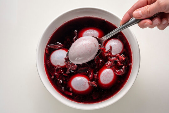 Coloring Easter eggs with natural dye carcade tea from hibiscus flowers