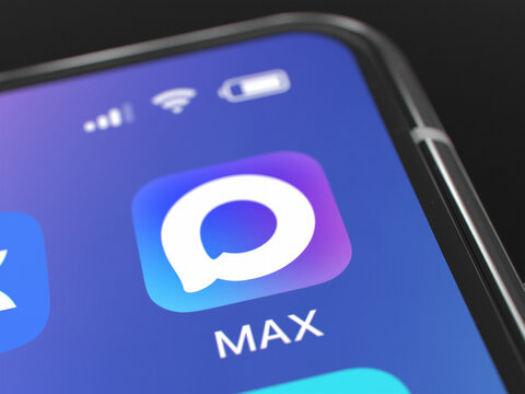 Close up of MAX application icon on a smartphone screen with status bar and battery indicator. Mobile software interface for communication and messaging. Astana, Kazakhstan - September 3, 2025