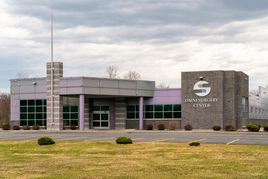 Utica, NY - Mar 30, 2026: The Omni Surgery Center, a multi-specialty ambulatory surgical facility in Utica, NY, is shown under an overcast sky. Established in 2015 by Dr. Nameer 