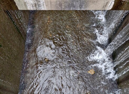 Water in motion. Scene showing water in perpetual motion with twisting circular flows and eddy formations