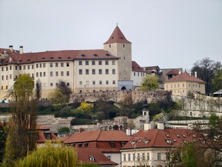 Obraz premium Ruinous castle perched above terraced lands showcasing timeless resilience and historic charm