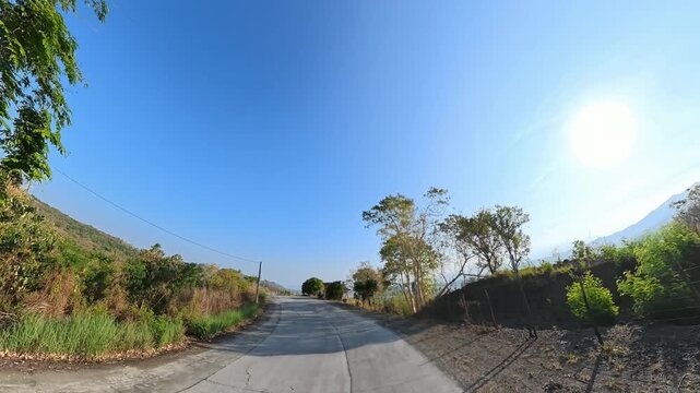 Scenic winding highway with mountain view has fast-paced effect without sound