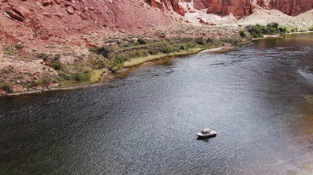 Elevated Overhead View Of Power Boat Drifting On The Colorado River Near Lees Ferry Arizona