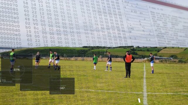 Coach placing ball gesturing soccer players training passing right on pitch, hex overlays appearing