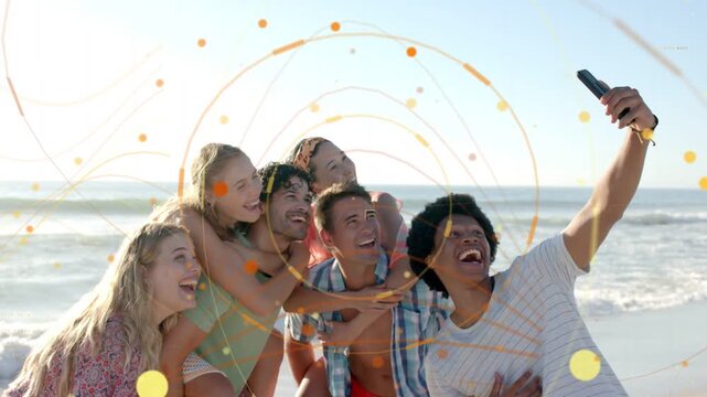 Friends leaning in, holder raising phone causing spiral overlay over group for social media selfie