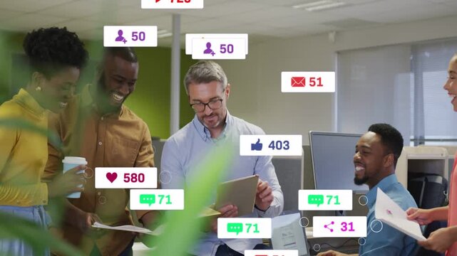 Marketing team scanning tablet, generating social icons growing then fading while reviewing metrics